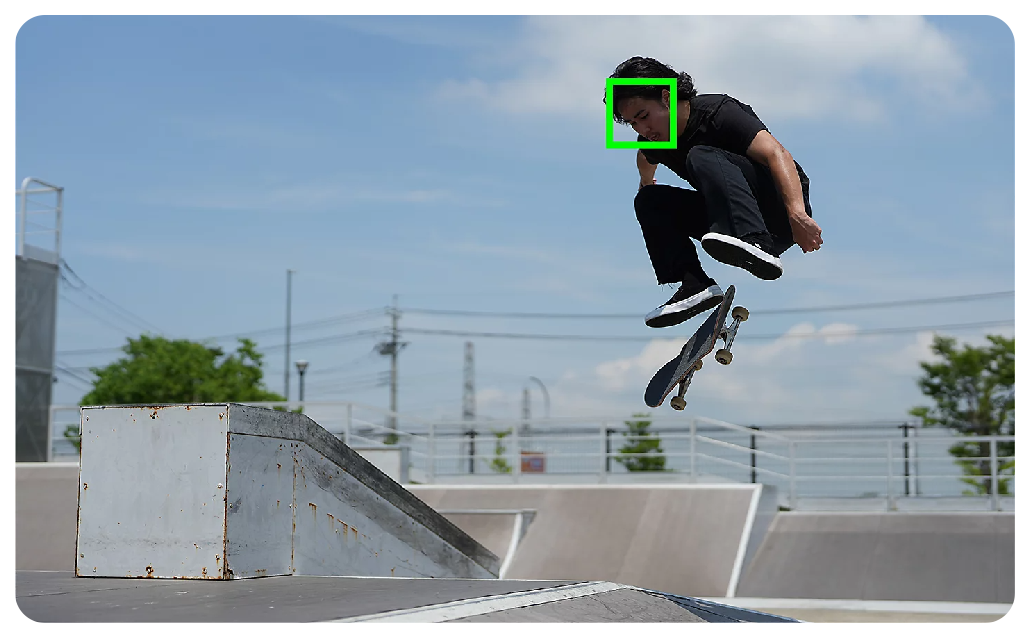Sony A7 IV sample image of skateboarder performing kickflip over a box jump in a skatepark